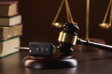 pplication form for car loan, pen and key on wight table, close up view