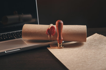 justice and law concept. Lawyer workplace with laptop and documents with dark wooden. Notary's...