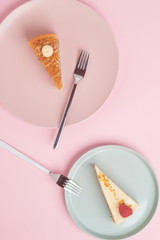 A piece of cake, cheesecake on a plate with a fork on a pink background.