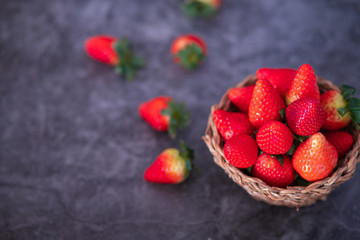 Strawberries on dark background. Place to text.
