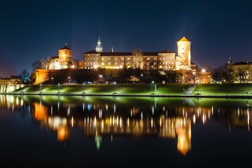 Fototapeta na wymiar Wawel Castle in Krakow seen from the Vistula boulevards. Krakow is the most famous landmark in Poland