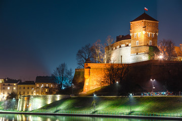 The Royal Wawel Castle as seen from another bank of Vistula. Krakow is the most famous landmark in Poland. Night view