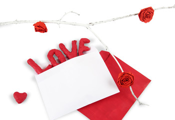 Word LOVE in the envelope, hearth and three paper rose isolated on white background. Concept of Valentine's Day.