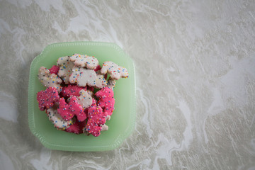 Obraz na płótnie Canvas Frosted Circus Animal Cookie Pink and White Sprinkled Animal Crackers