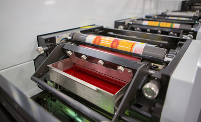 Flexographic printing machine with an ink tray, ceramic anilox roll, doctor blade and a print...