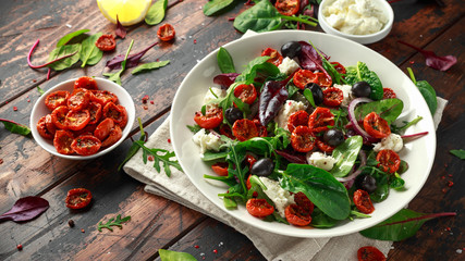 Sun dried tomatoes Salad with fresh vegetables mix and mozzarella cheese. healthy food