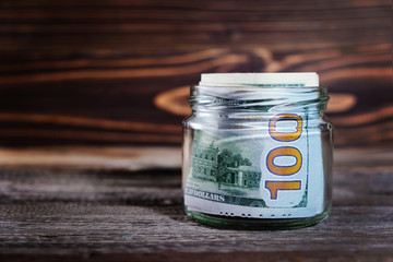 saving money in jar with American dollars , cash