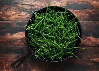 Fresh green samphire in cast iron skillet