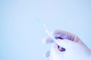 Medical hand gloves dispose drug insullin needle syringe, concept flu shot vaccine vial dose...