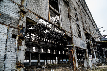 Fototapeta na wymiar Abandoned industrial building. Ruins of an old factory