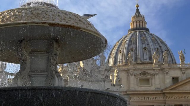 Water falling from a fountain by St. Peter's Basilica in Vatican City. Slow motion shot