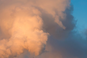 Smoke, clouds in the blue sky. Abstract background for design and project. Concept: ecology, weather