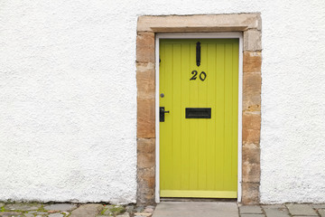 Obraz na płótnie Canvas Yellow door old wooden rustic ancient house entrance