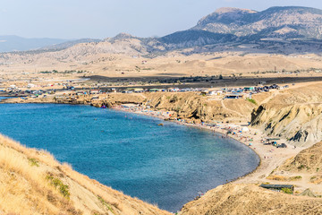 Fototapeta premium Bay and beach at the foot of the mountains