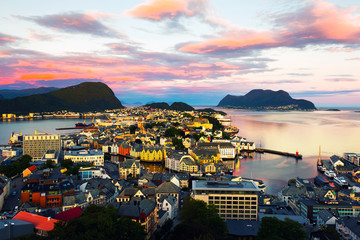 Aerial view of Alesund, Norway at sunrise. Colorful cloudy sky