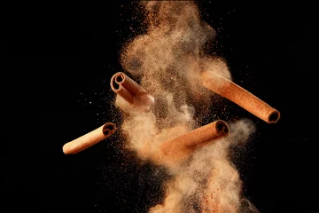 Zelfklevend Fotobehang Food explosion with cinnamon sticks and powder © Melica