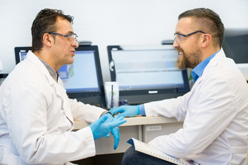 Two mature scientists collaborating for research