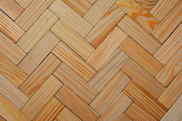 wooden background consisting of the boards which are laid out in a geometrical pattern