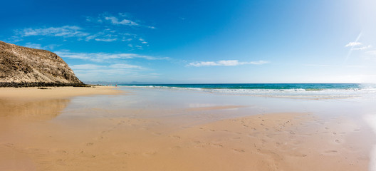 Fototapeta na wymiar Panorama of the sandy beach on the Canary Islands