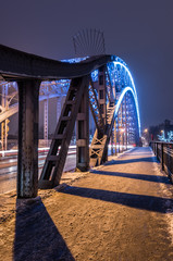Truss bridge in the night decorated for Christmas, Krakow, Poland