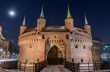 Fototapeta premium Krakow, Poland, medieval barbican (Barbakan) in the night