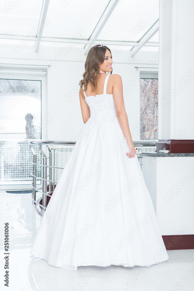 Wall mural beautiful young bride in white wedding dress