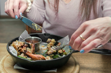 woman eating in restaurant