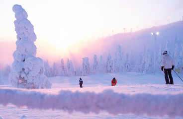 Ski slope, a group of skiers slides down the mountain. Winter, extreme sport.