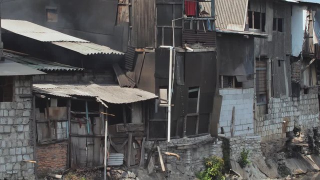 Slum area on the riverbank in Jakarta. Indonesia.