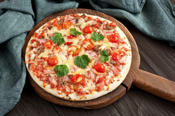 Traditional  italian pizza on wooden table
