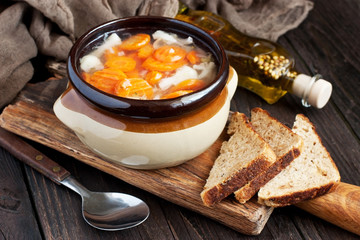 Bowl of vegetable soup with rye bread