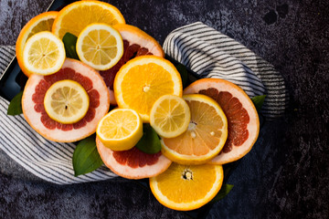 Various citrus fruits- orange- tangerine- grapefruit and lemon.