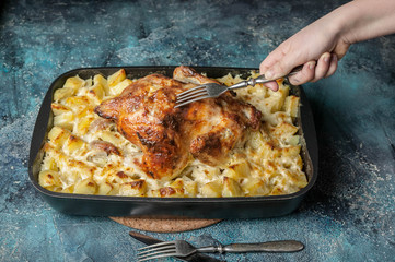 Baked chicken and cheese potatoes in cast iron