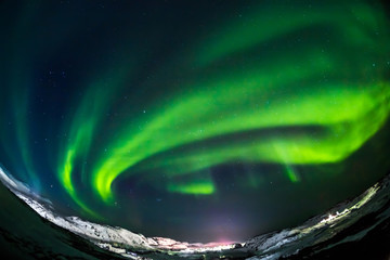 Aurora borealis Green on Teriberka in Murmansk region, Russia