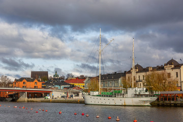 Porvoo town, Finland. Old red wooden houses on the river coast on a cloudy day