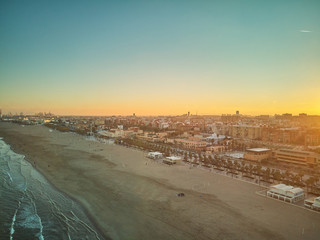 Aerial view of the skyline at sunset from the Malvarrosa beach in Valencia. Spain