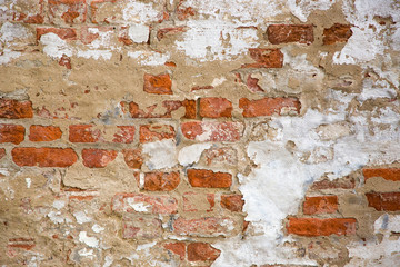 Beige Plastered Brickwall With Chipped Stucco Pieces. Red Textured Brick Wall With Damage Surface. Old Grunge Abstract Background.