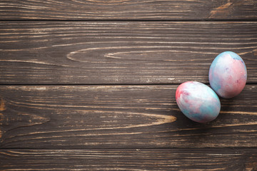 Easter eggs on wooden background. Spring and Easter holiday. Minimalistic design.