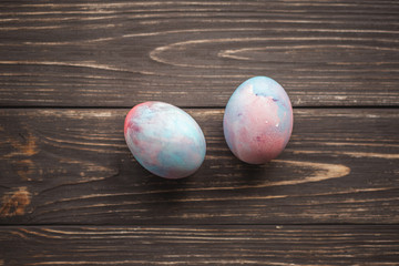 Easter eggs on wooden background. Spring and Easter holiday. Minimalistic design.