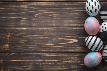 Easter eggs on wooden background. Spring and Easter holiday. Minimalistic design.