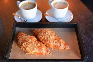 freshly baked croissants with aromatic coffee