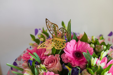 a bouquet of flowers (roses, gerberas, lilies, irises) 
