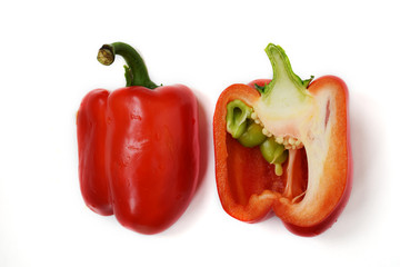Two half of a bright red raw washed with green tail bulgarian sweet pepper isolated on white background