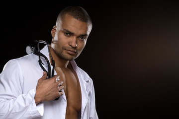 Seductive shirtless African male doctor