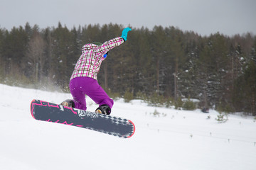 snowboarder jumping in air