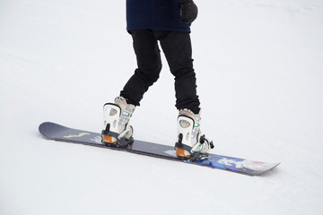 snowboarder jumping on mountain slope