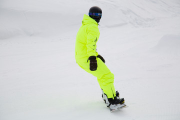 snowboarder jumping on mountain slope