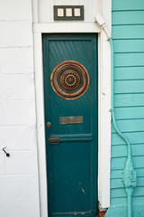 old narrow green wooden door in new orleans