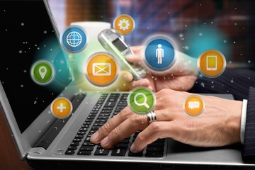Young business man in suit working with laptop