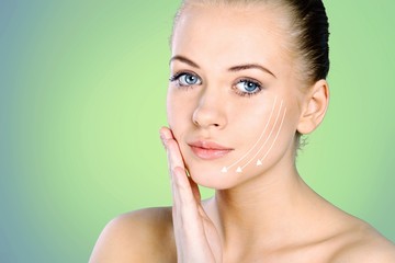 Close up portrait of beautiful young woman face . Isolated on  background. Skin care or spa concept, caucasian